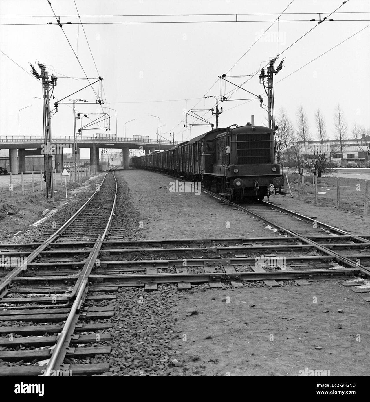 The tram crosses the railway. The State Railways Diesllok SJ