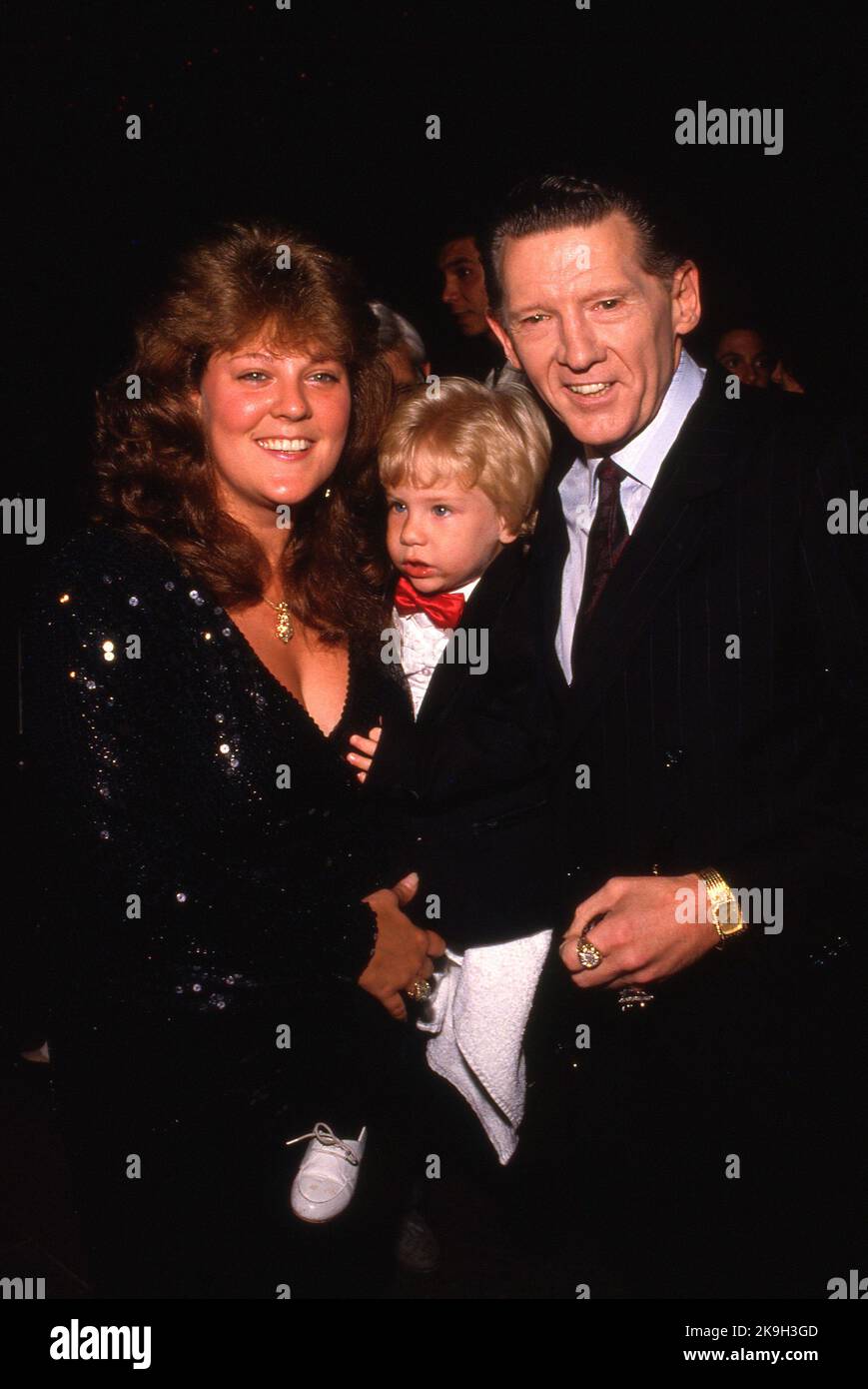 **FILE PHOTO** Jerry Lee Lewis Has Passed Away at 87. Jerry Lee Lewis and wife Kerrie w. their son at party for film Great Balls of Fire June 26, 1989 Credit: Ralph Dominguez/MediaPunch Stock Photo