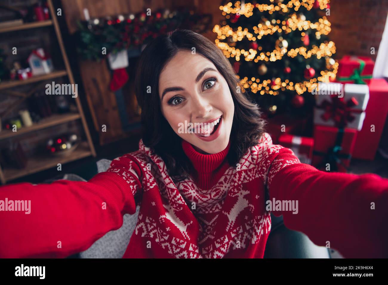 Portrait of positive attractive person make selfie tongue lick teeth have good mood house indoors Stock Photo