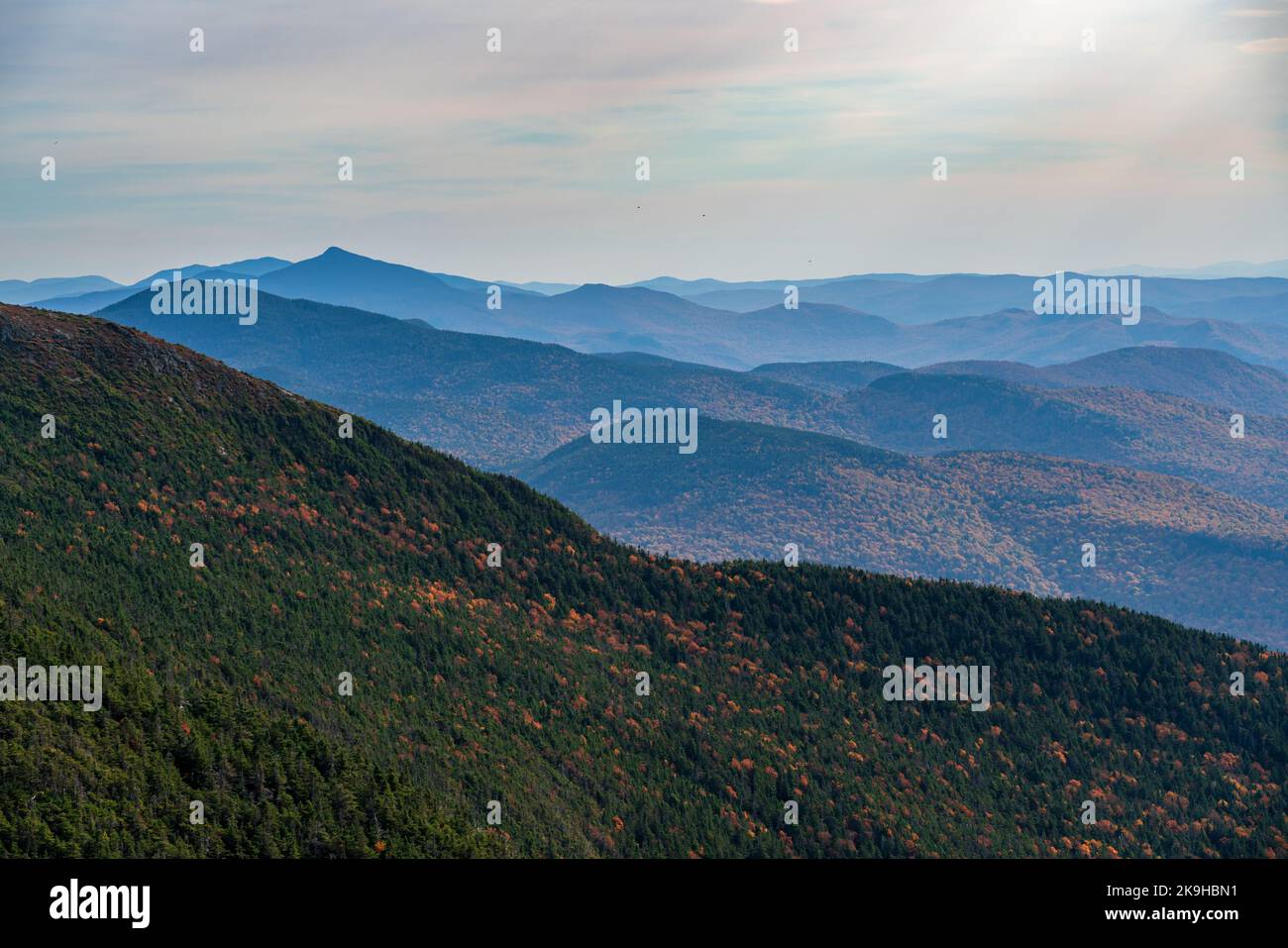 Receding summits of the Green Mountains to Camels Hump in the distance from Mount Mansfield Stock Photo