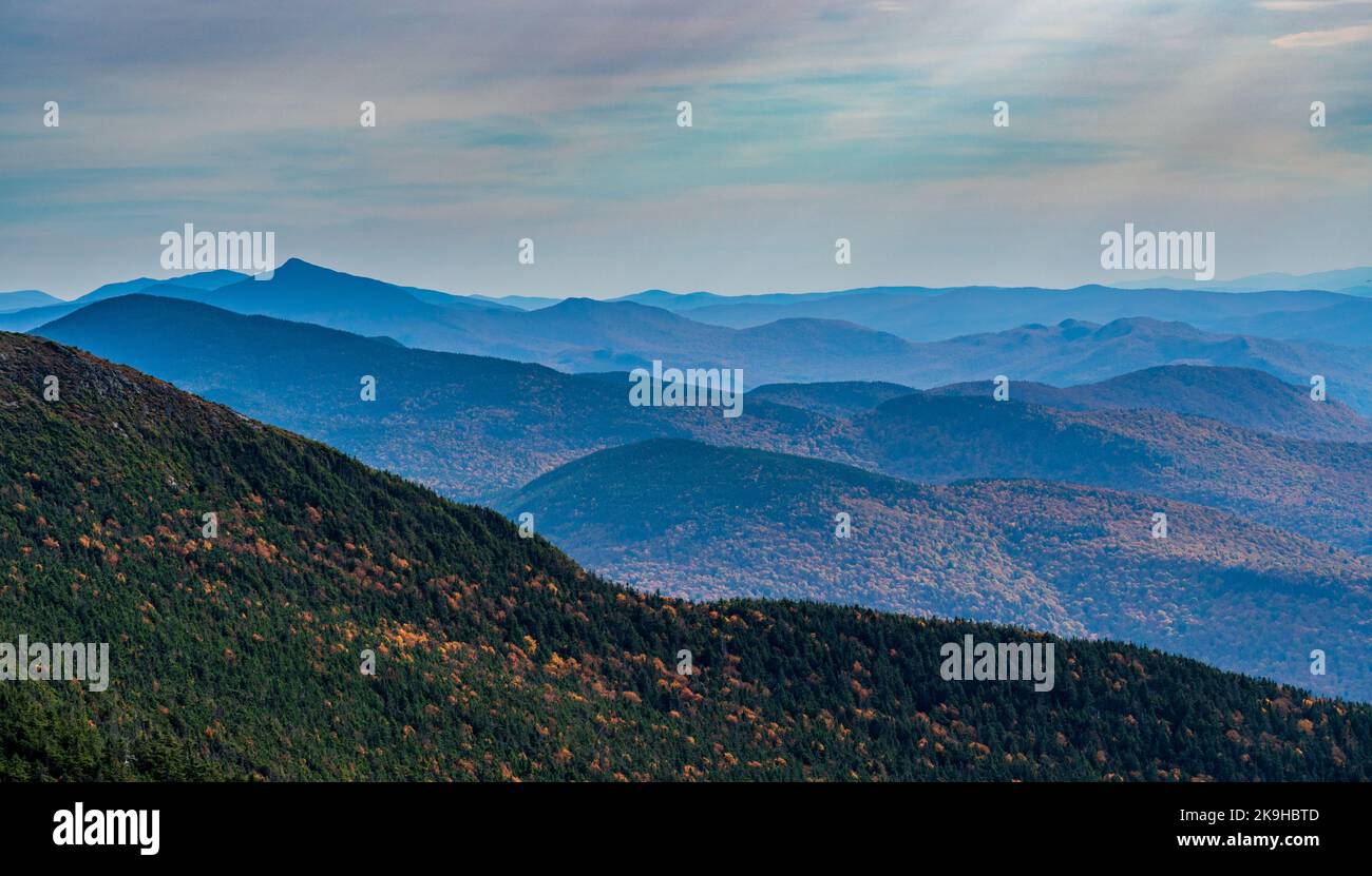 Receding summits of the Green Mountains to Camels Hump in the distance from Mount Mansfield Stock Photo