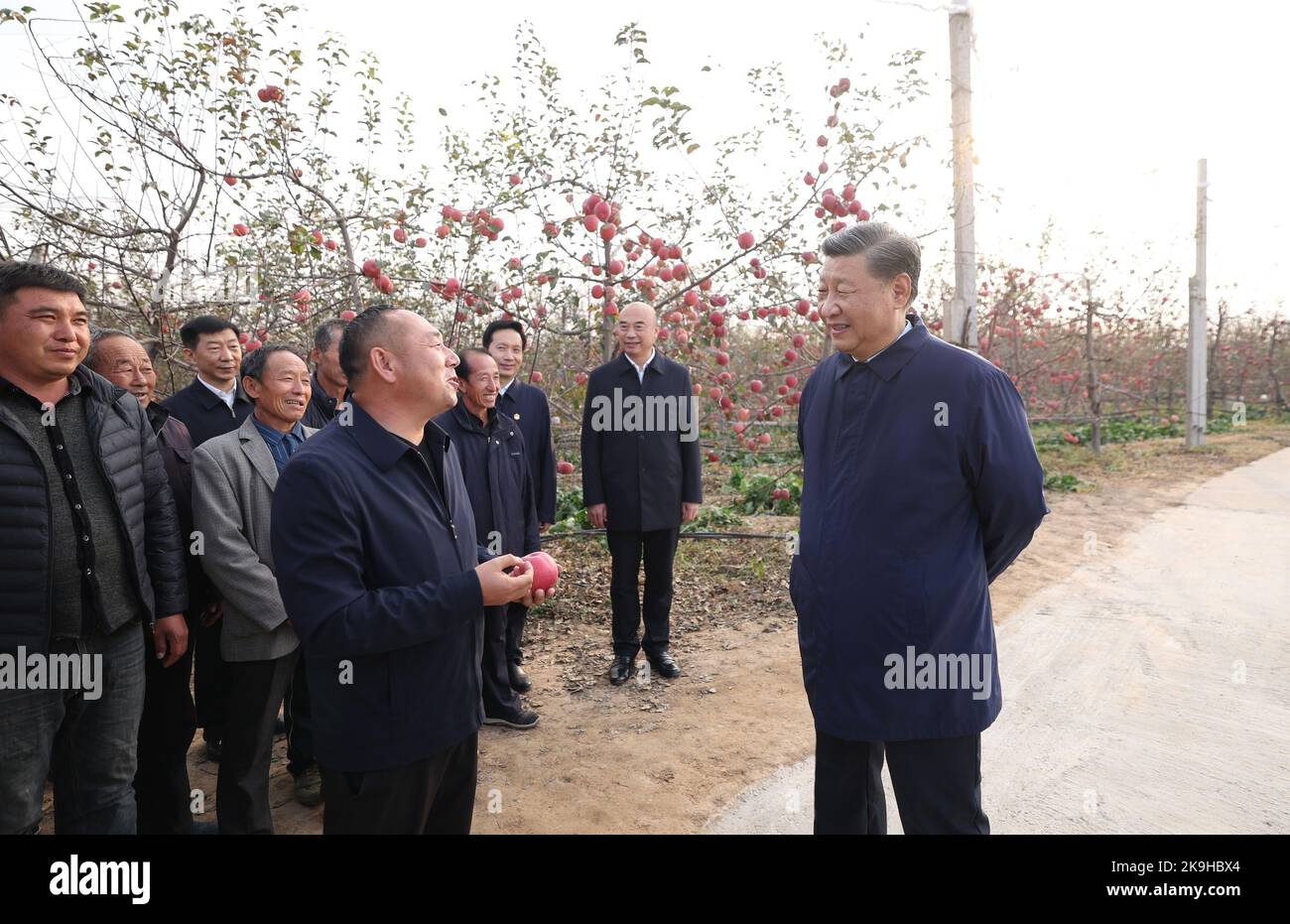 Yan'an, China's Shaanxi Province. 26th Oct, 2022. Chinese President Xi Jinping, also general secretary of the Communist Party of China Central Committee and chairman of the Central Military Commission, chats with local villagers in an orchard in Nangou Village of Yan'an, northwest China's Shaanxi Province, Oct. 26, 2022. Xi made an inspection trip to the city of Yan'an in northwest China's Shaanxi Province and the city of Anyang in central China's Henan Province, from Wednesday to Friday. Credit: Ju Peng/Xinhua/Alamy Live News Stock Photo