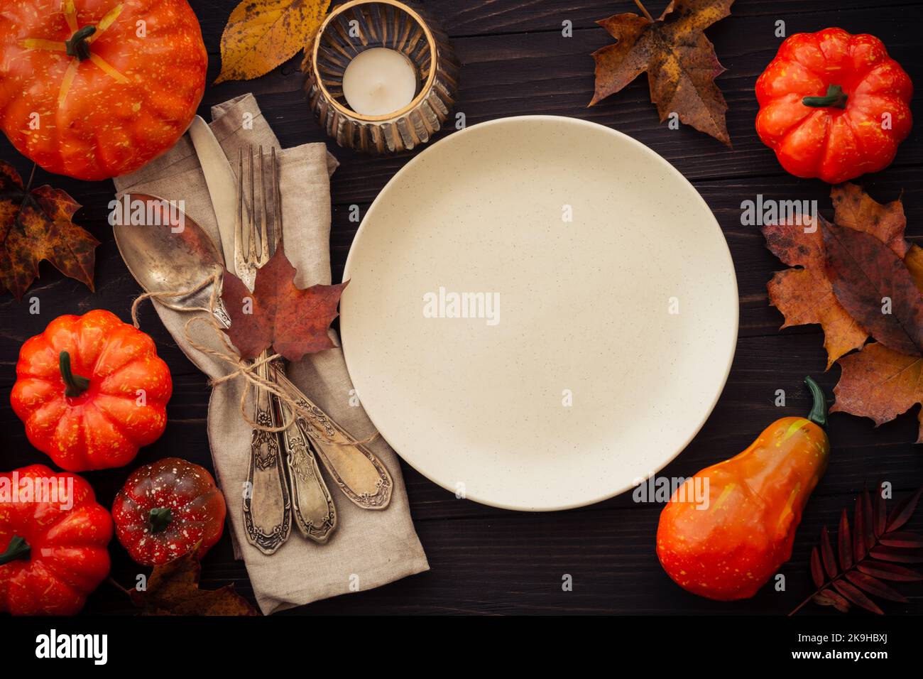 Fall table setting at dark background top view Stock Photo - Alamy