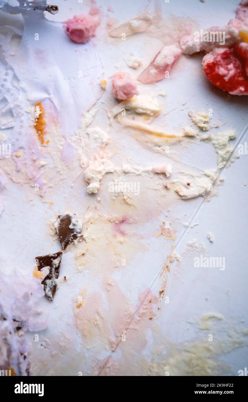 Overhead view of the remains of a creamy cake Stock Photo