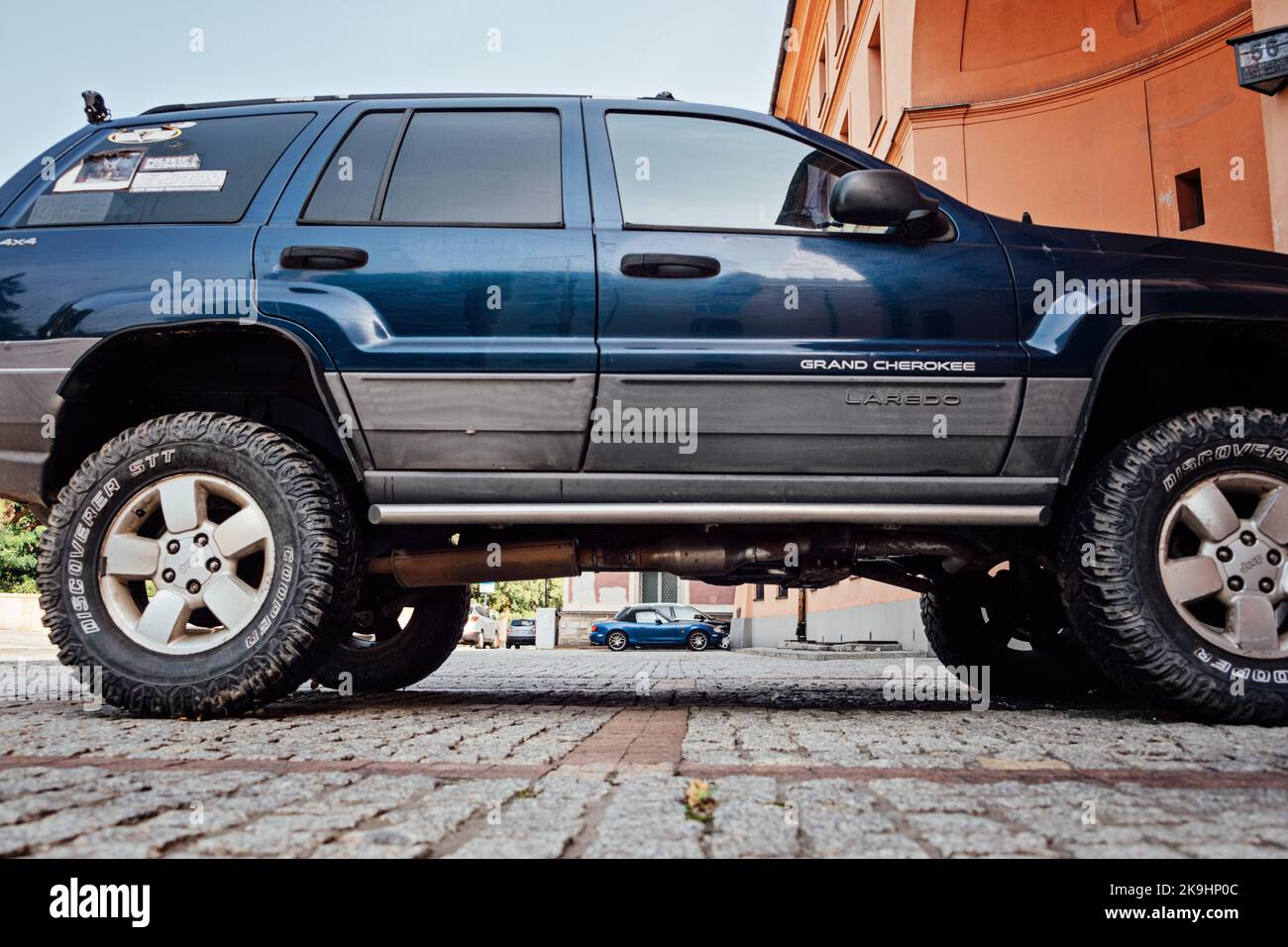 Cars with High and Low Ground Clearance. Two cars with low and high