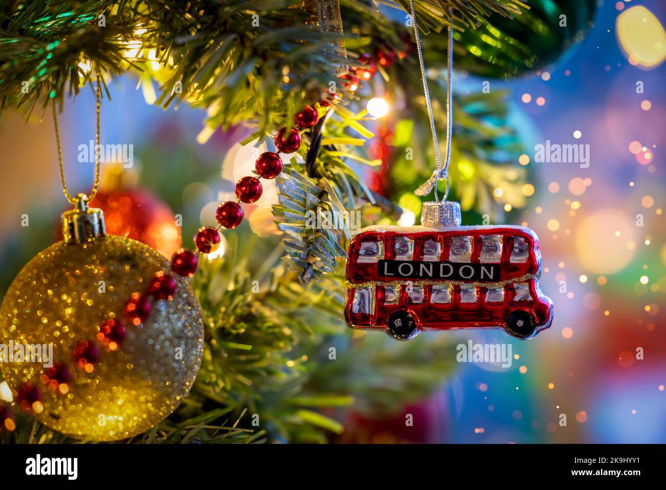 A little, red double decker bus from London as a christmas ornament Stock Photo