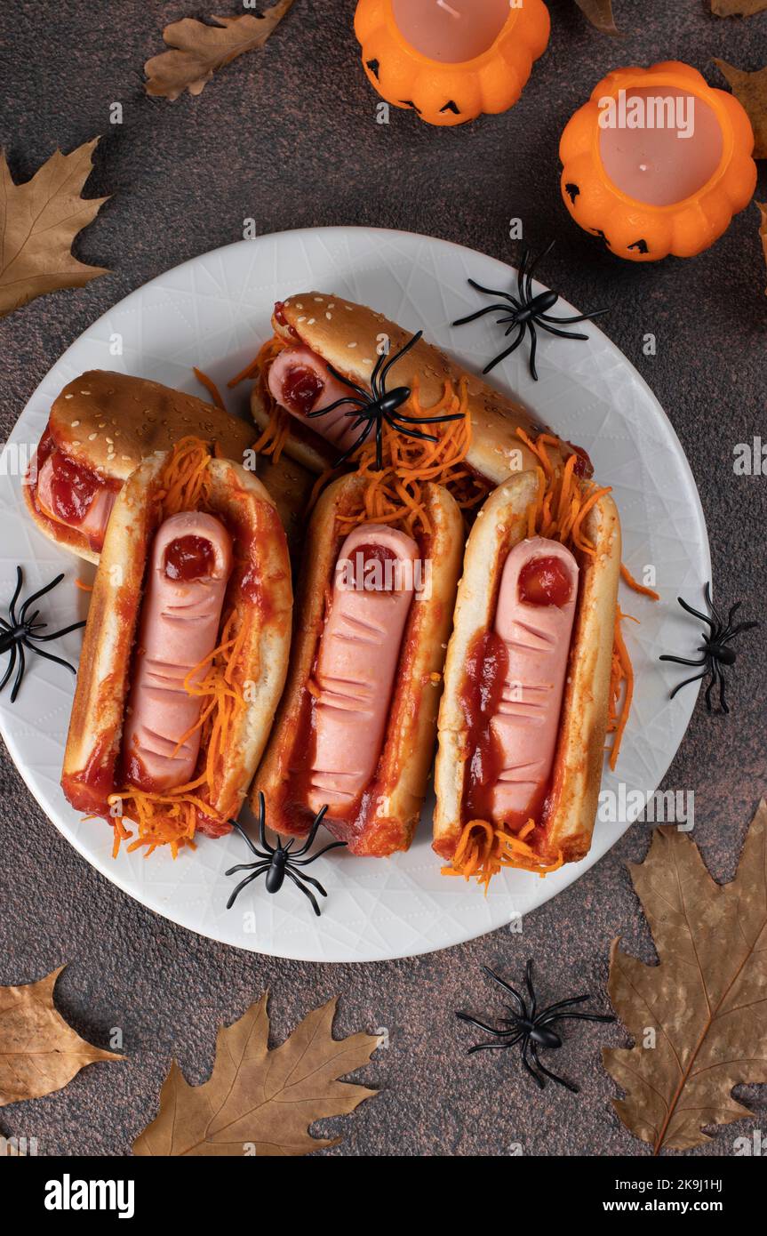 Themed food for Halloween party hot dog with bloody sausage fingers in