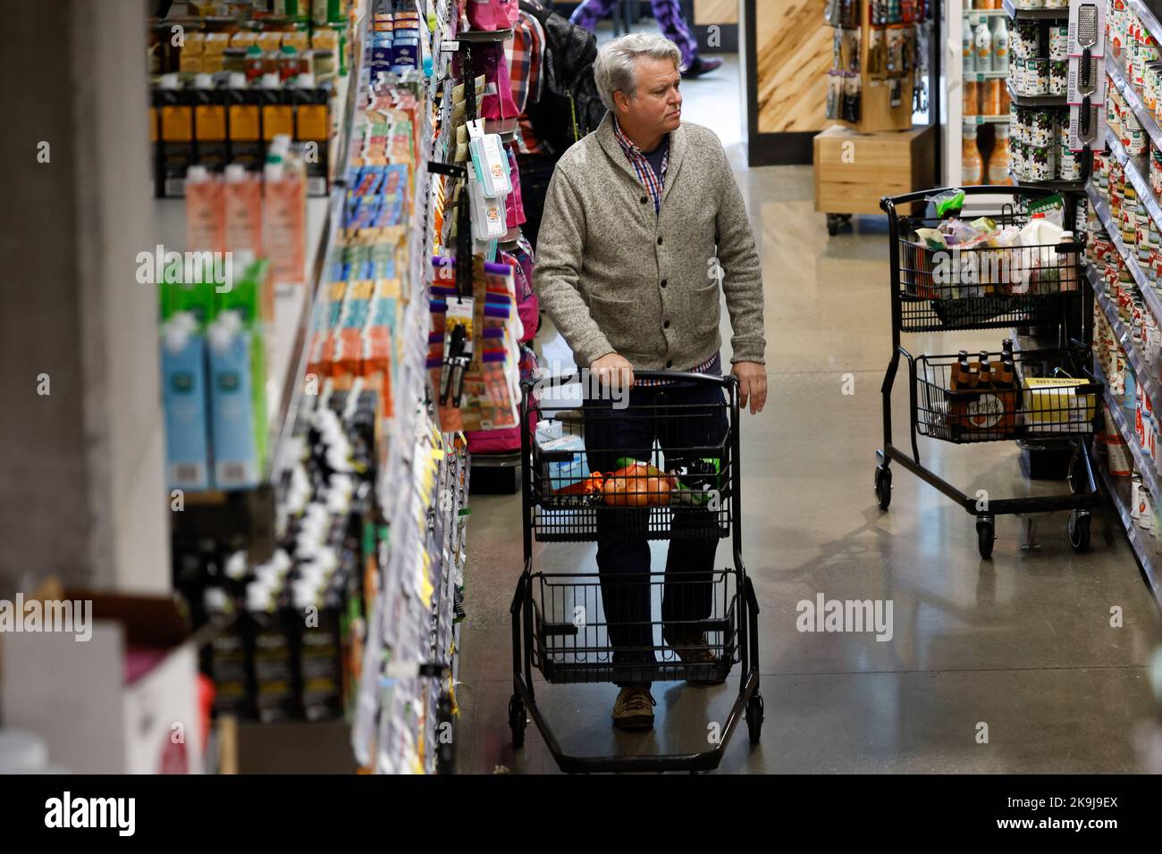 Washington DC, USA. 28th Oct, 2022. A customer shops at a supermarket in Washington, DC, the United States, on Oct. 28, 2022. U.S. consumer sentiment ticked upward somewhat in October, although inflation continued to strangle the incomes of many American households. Credit: Ting Shen/Xinhua/Alamy Live News Stock Photo