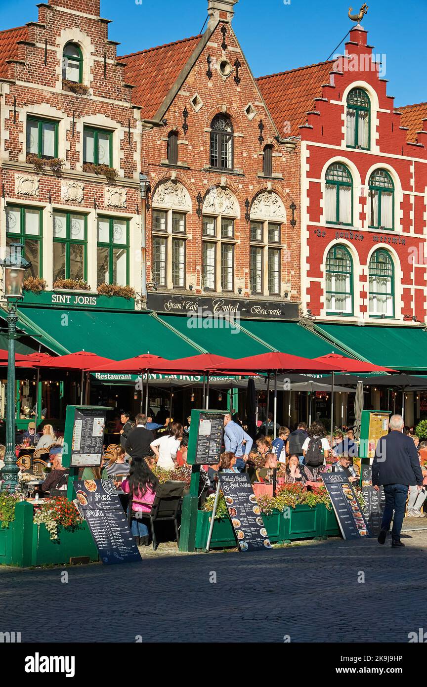 Brick buildings in Flemish architecture style line The Markt (Market Square) in central Bruges, Belgium. Stock Photo