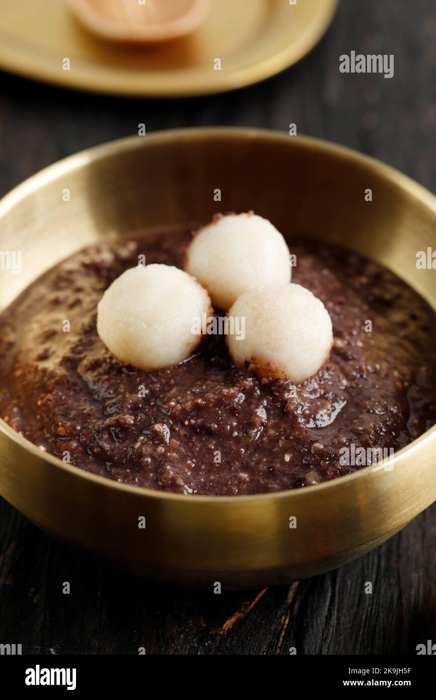 Patjuk, Korean Red Bean Porridge with Rice Cake on Top. Stock Photo