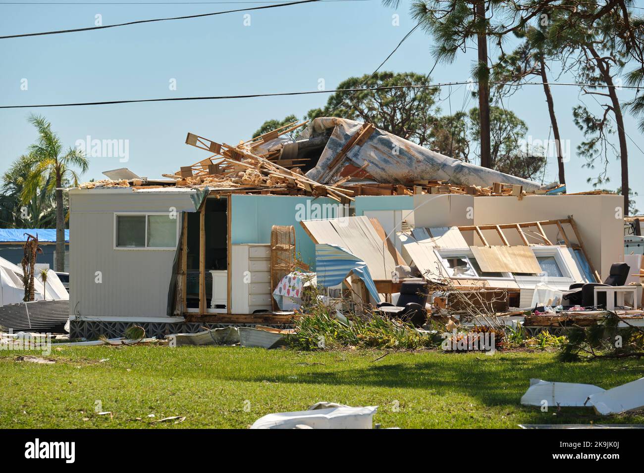 Severely damaged house after hurricane Ian in Florida mobile home