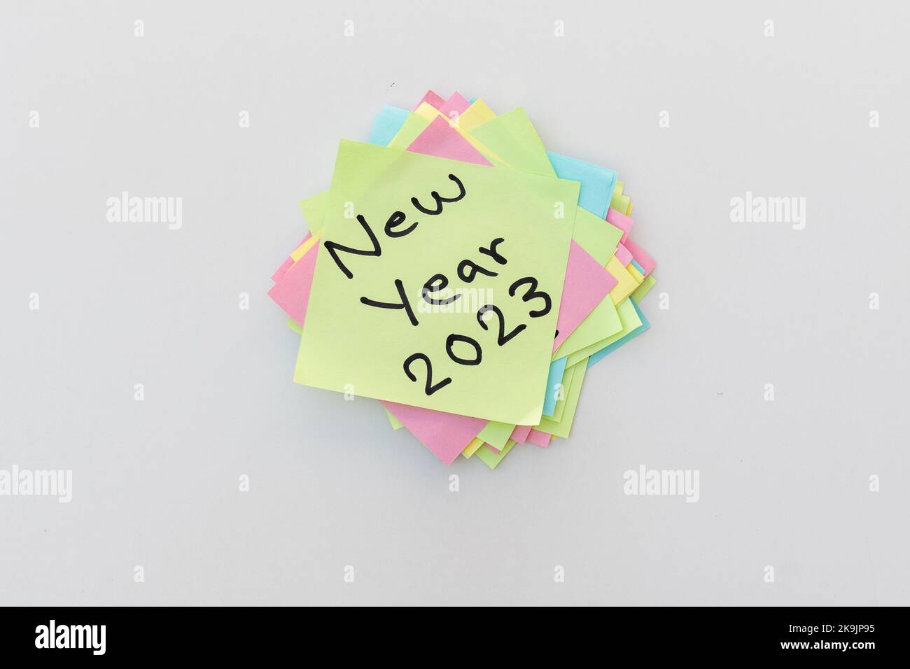 New year 2023 hand written message on a yellow sticky note Stock Photo