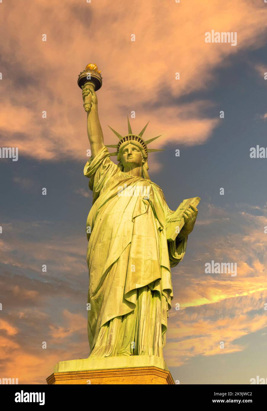 Statue of Liberty at sunrise in golden tones front view Stock Photo Alamy