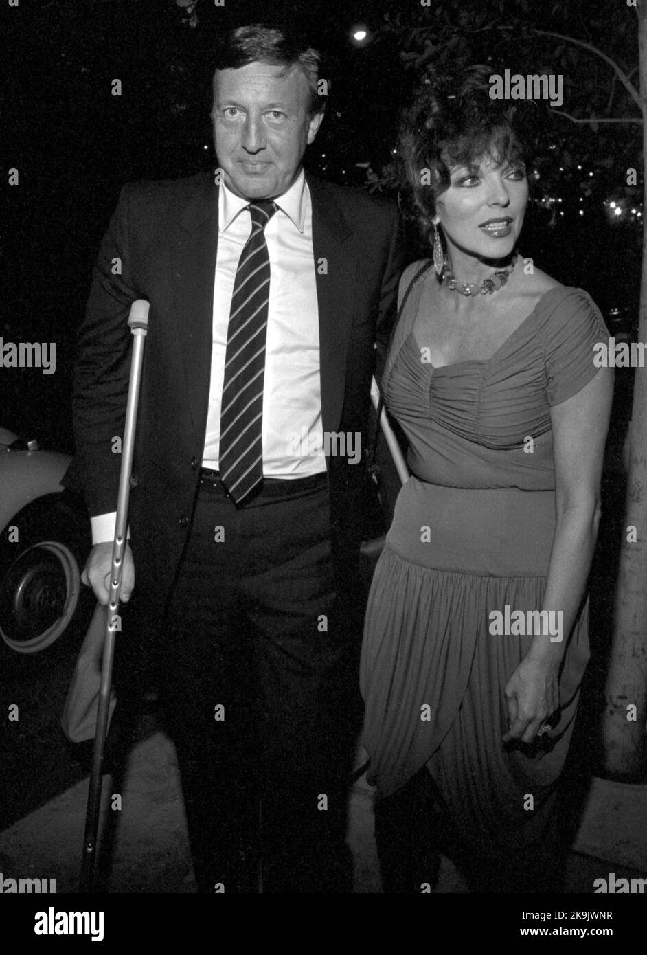 Joan Collins and Ron Kass Circa 1980's  Credit: Ralph Dominguez/MediaPunch Stock Photo