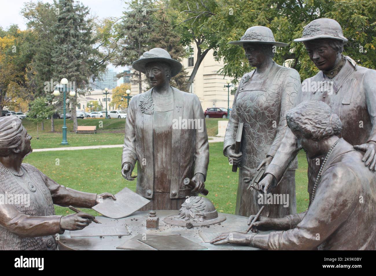 A statue of the Famous Five women in front of the legislature building