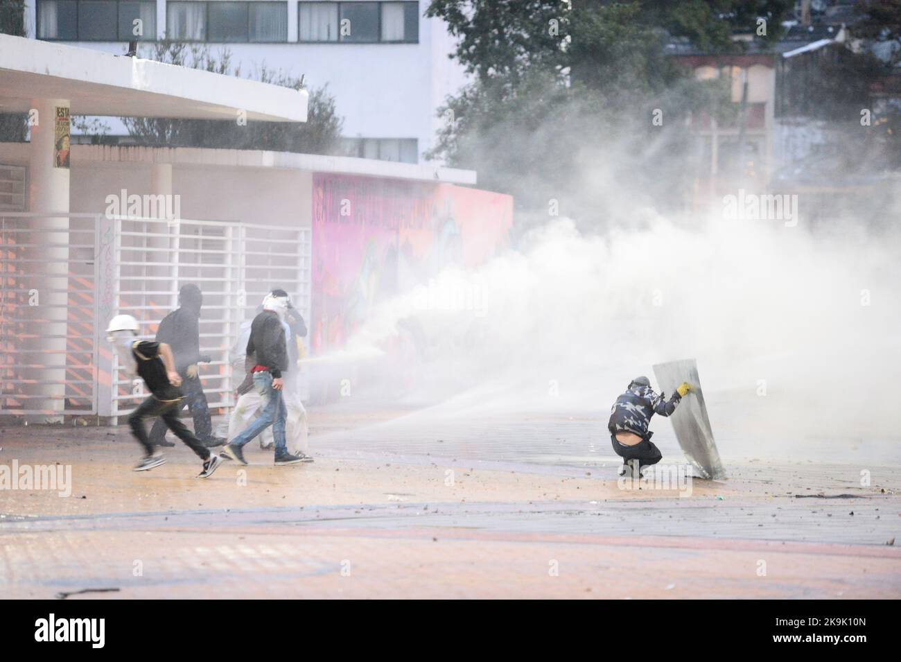 Demonstrators clash with Colombia's anti-riot police squadron (UNDOMO) formerly knwon as ESMAD clashes as protests raise in Bogota, Colombia amid the liberation of political prisioners captured during the last year anti-government protests, on October 28, 2022. Photo by: Lina Gasca Martin/Long Visual Press Stock Photo