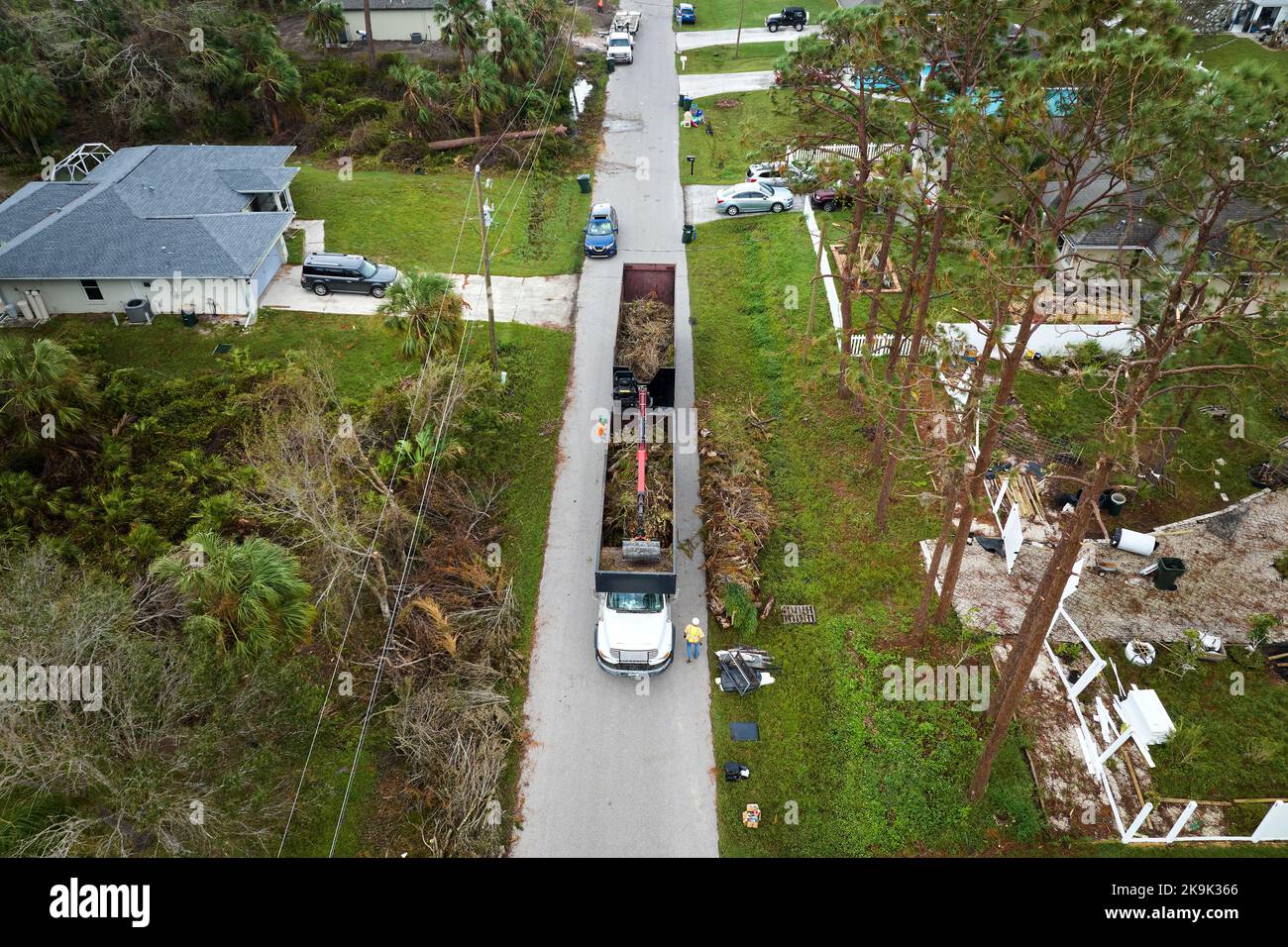 Top view of Hurricane Ian special aftermath recovery dump truck picking