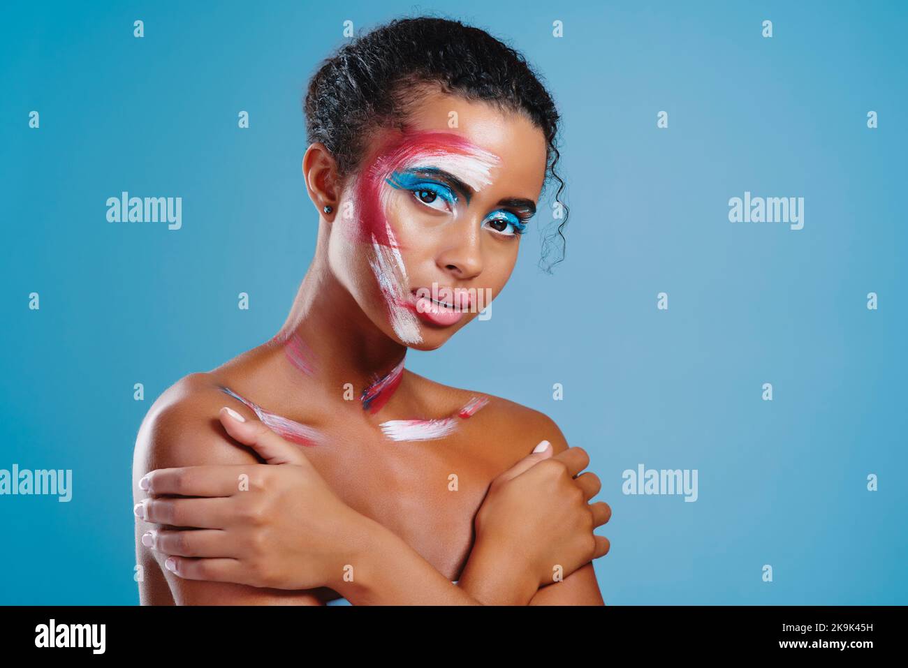 Close up of a woman with white paint all over her body stock photo