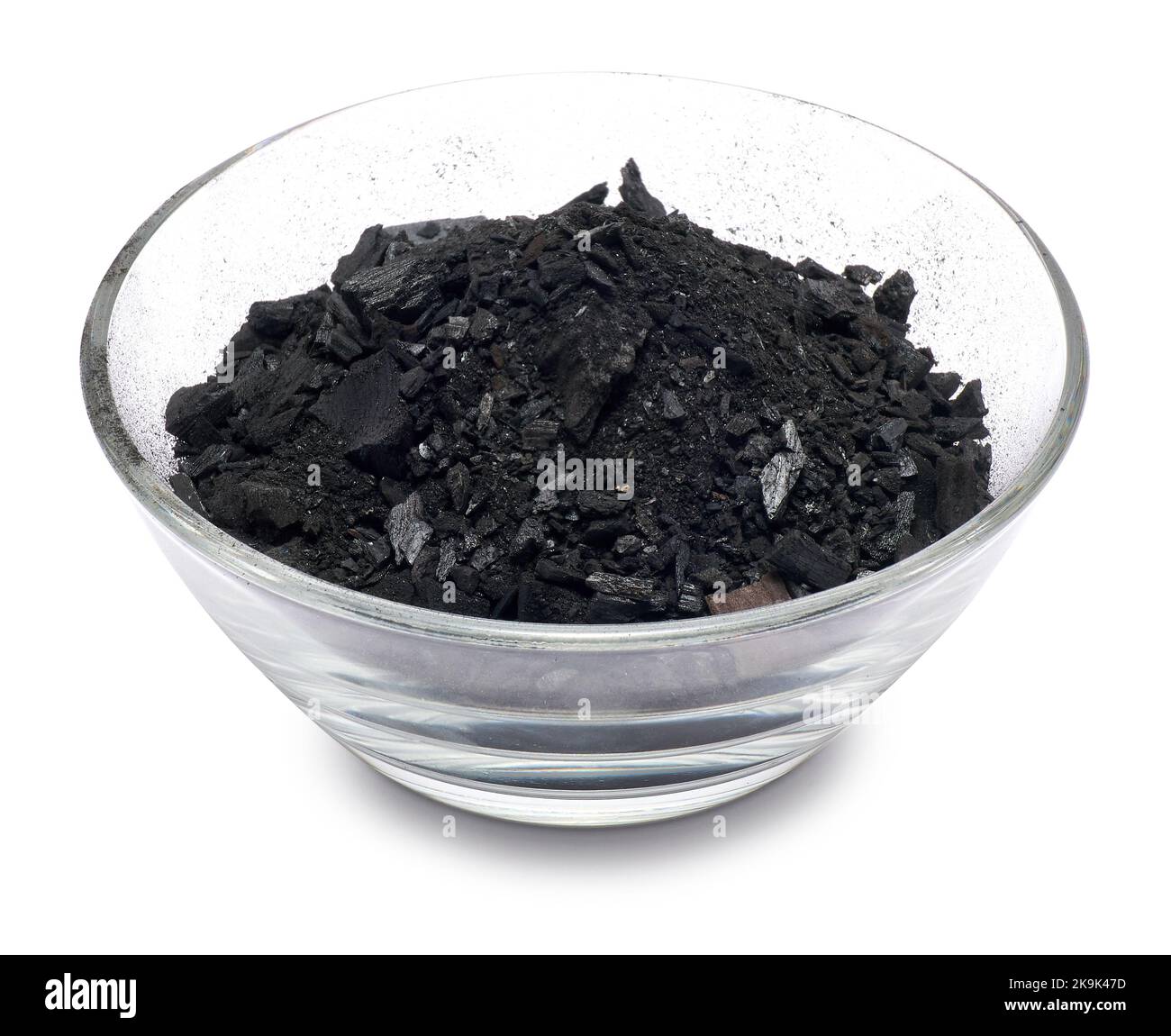 Natural wood charcoal in glass bowl for soil Isolated on white Stock