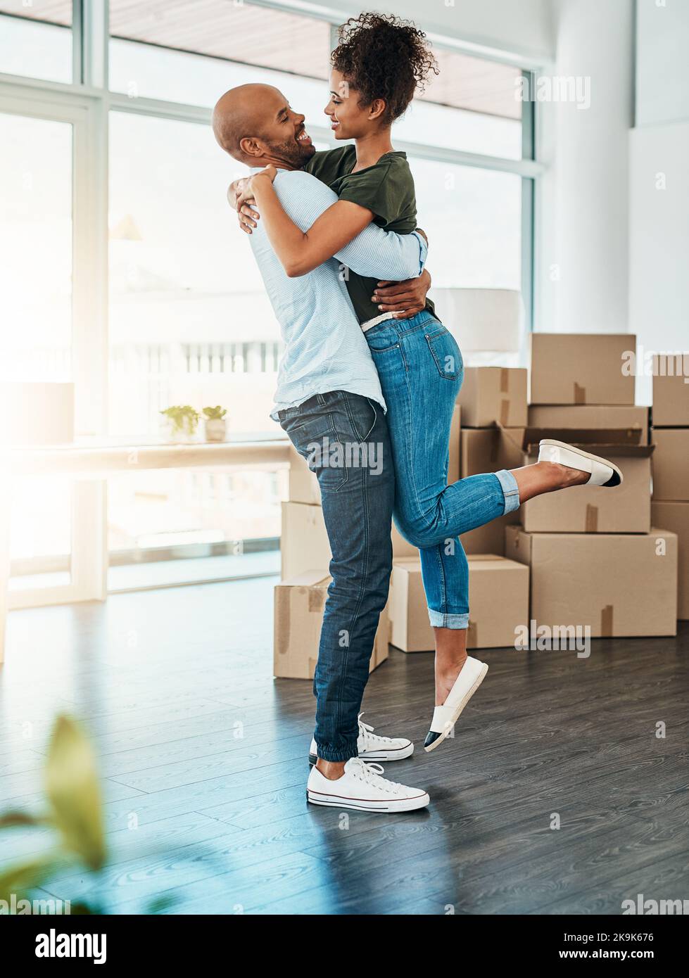 Picture of Its all ours. a young couple celebrating the move into their new home ...