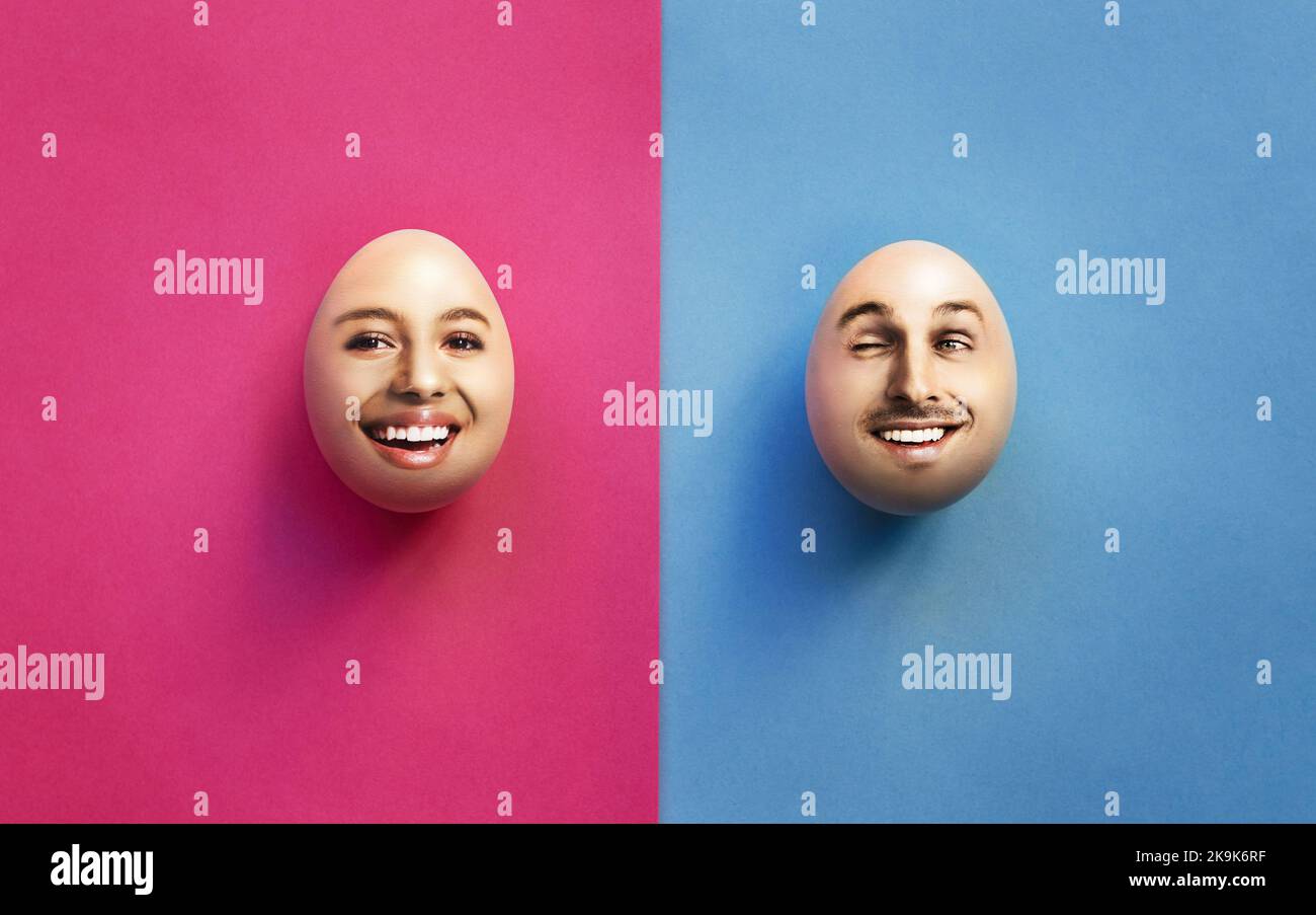 What came first The baby or the egg. Studio shot of a man and womans face on two eggs against a pink and blue background. Stock Photo