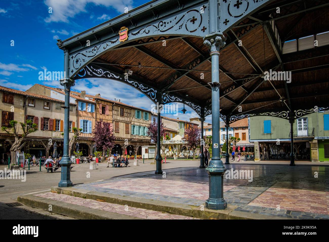 The covered market hall and the half timbered medieval houses on the main square of Mirepoix, in the South of France (Ariege) Stock Photo