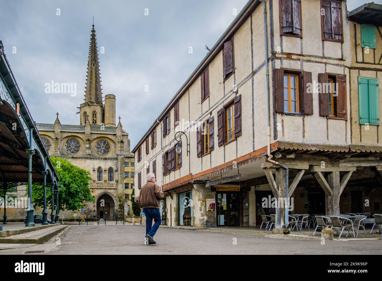 View on the half timbered medieval houses, the covered market hall and the Saint Maurice gothic cathedral in Mirepoix, in the south of France (Ariege) Stock Photo