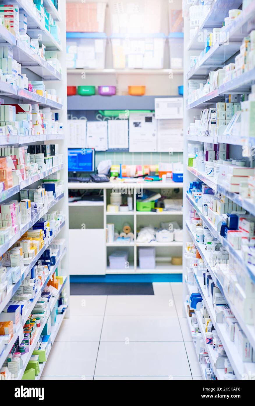 We have just the medicine for you. shelves stocked with various medicinal products in a pharmacy. Stock Photo