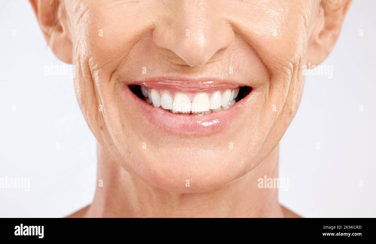 Teeth, mouth and smile of a senior woman with dental cleaning against a