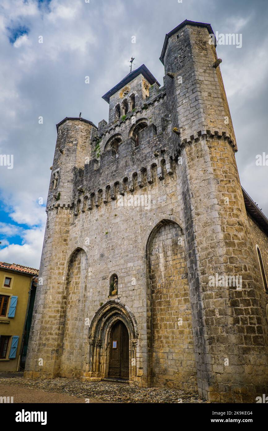 the fortified facade of the medieval church of the small village of Montjoie-En-Couserans in the French Pyrenees (Ariege) Stock Photo