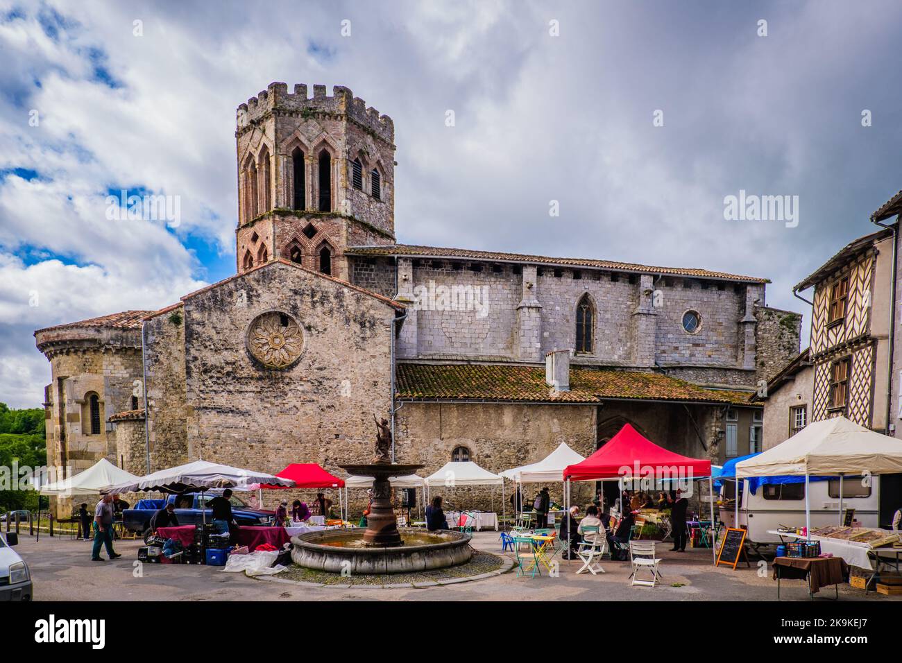 View on the Saint Lizier romanesque cathedral on market day in the South of France (Ariege) Stock Photo