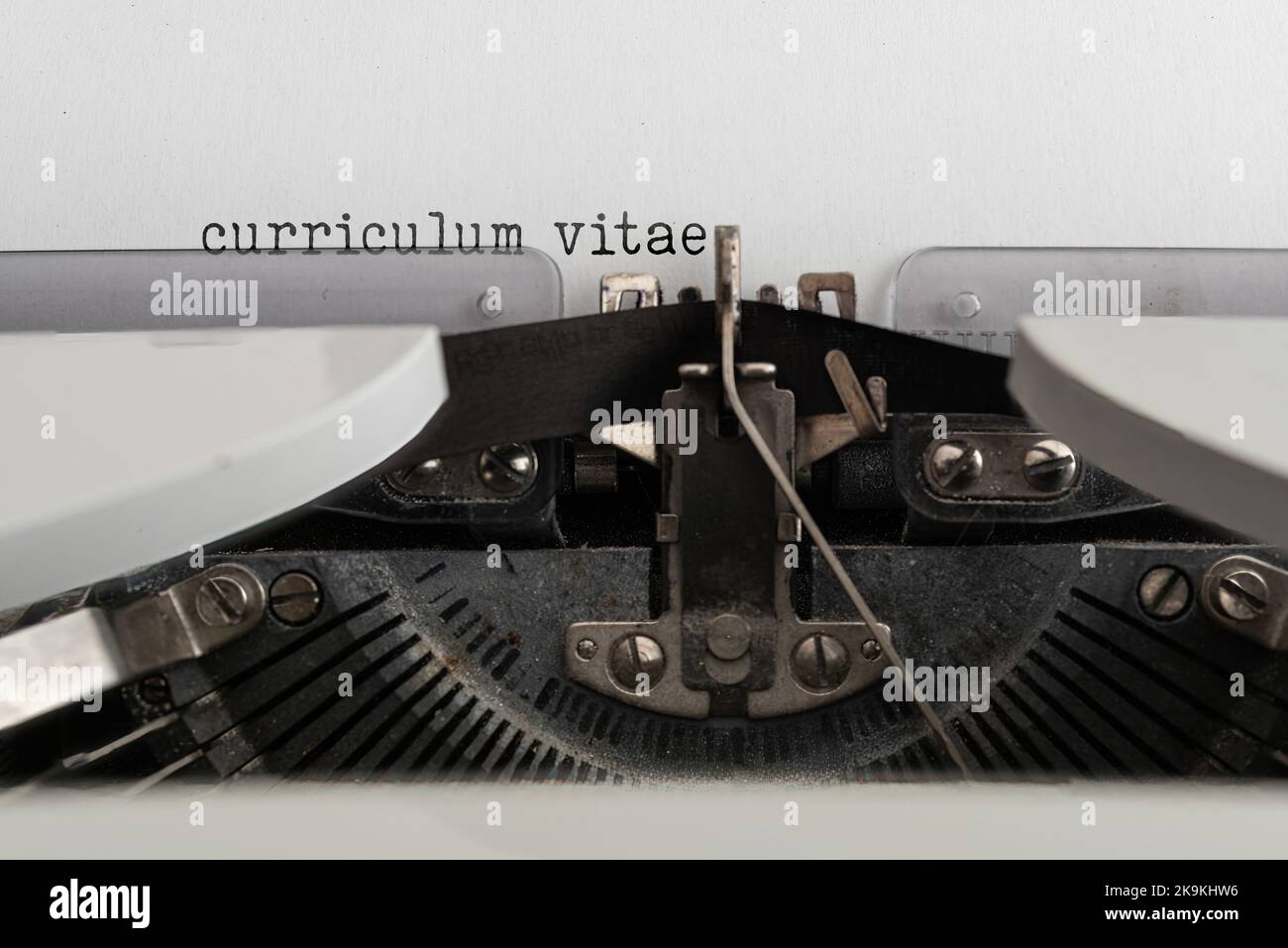 close-up of words CURRICULUM VITAE written on old mechanical typewriter Stock Photo