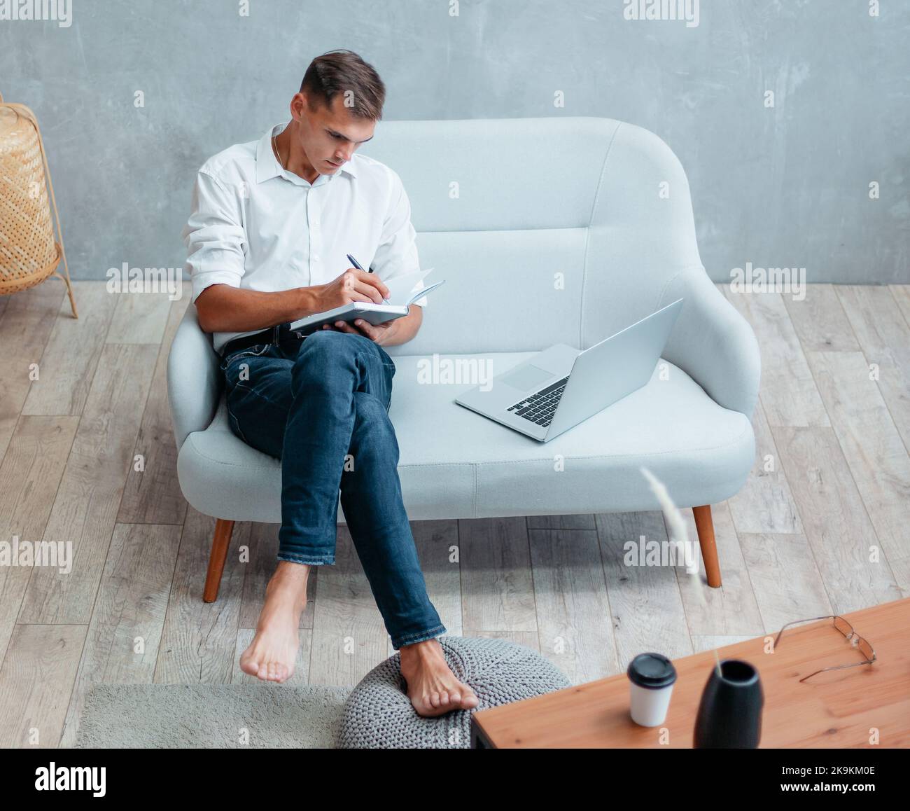 young entrepreneur making notes in a notebook. Stock Photo
