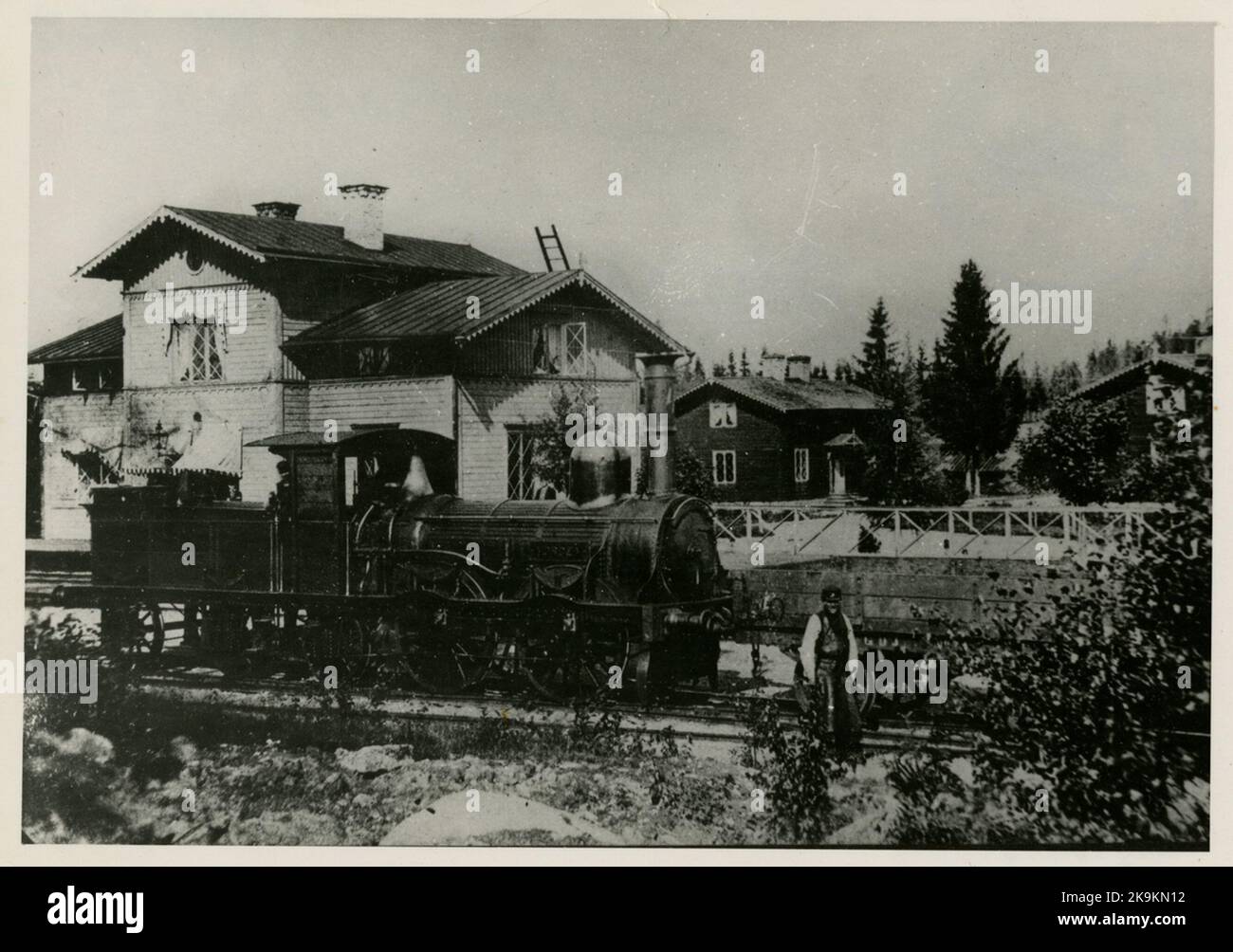 Robertsholm station before the name change to Hofors. In front of the station house is the Gävle-Dala Railway steam locomotive GDJ Lok 4 'Norden', and station man Olof Wallström, born 1836, died 26/6 1884. Employed 1/5 1861. Stock Photo