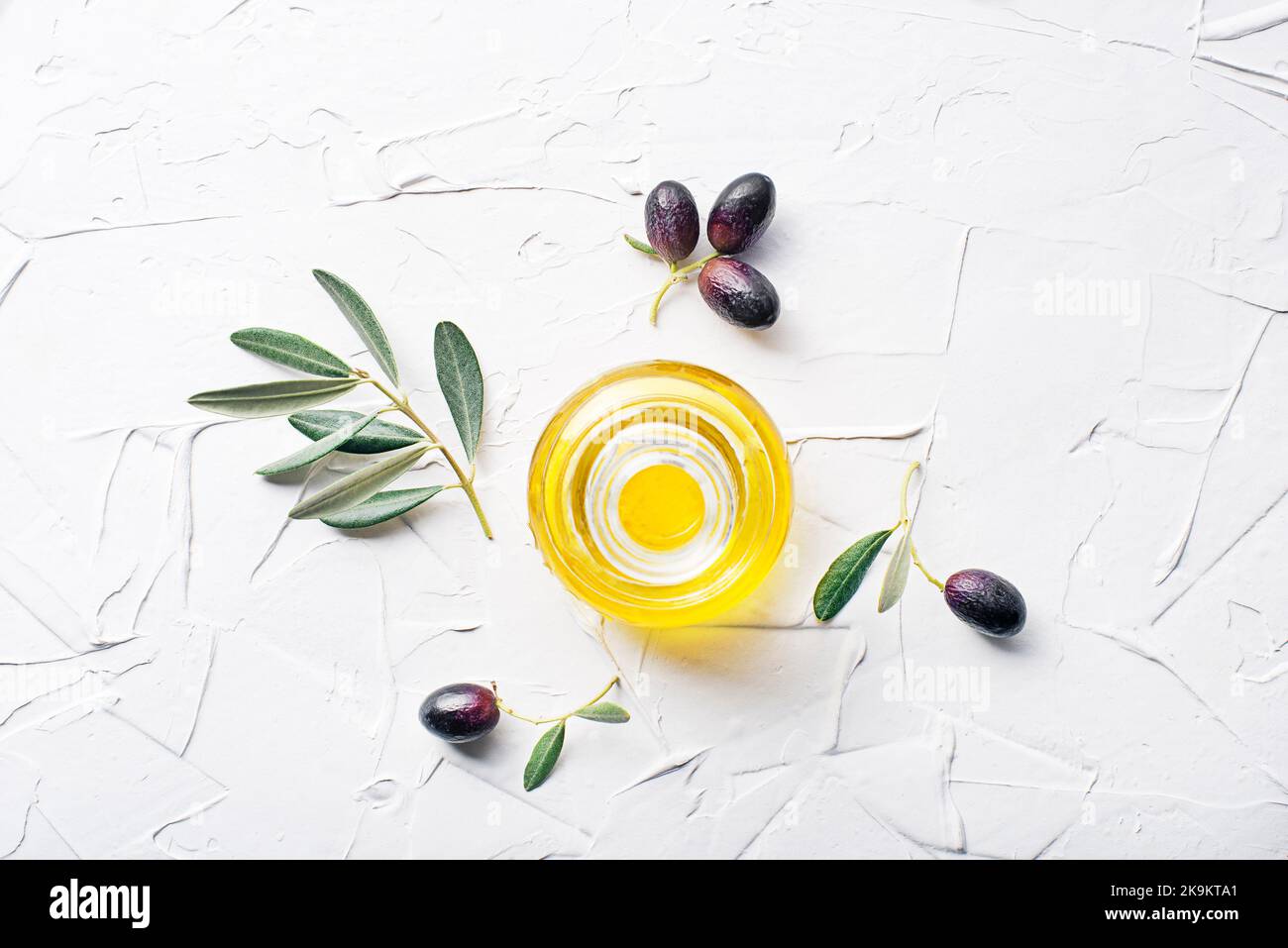Olive oil olives and olive branch on white background Stock Photo
