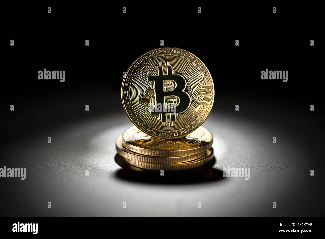 Bitcoin gold coin in black background. Virtual cryptocurrency concept. Stock Photo
