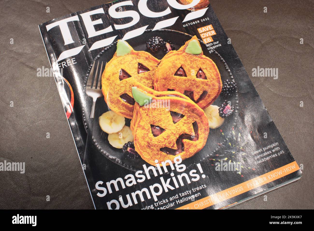Tesco Halloween catalogue October 2022 on a brown background. Tesco instore Halloween food guide magazine Stock Photo