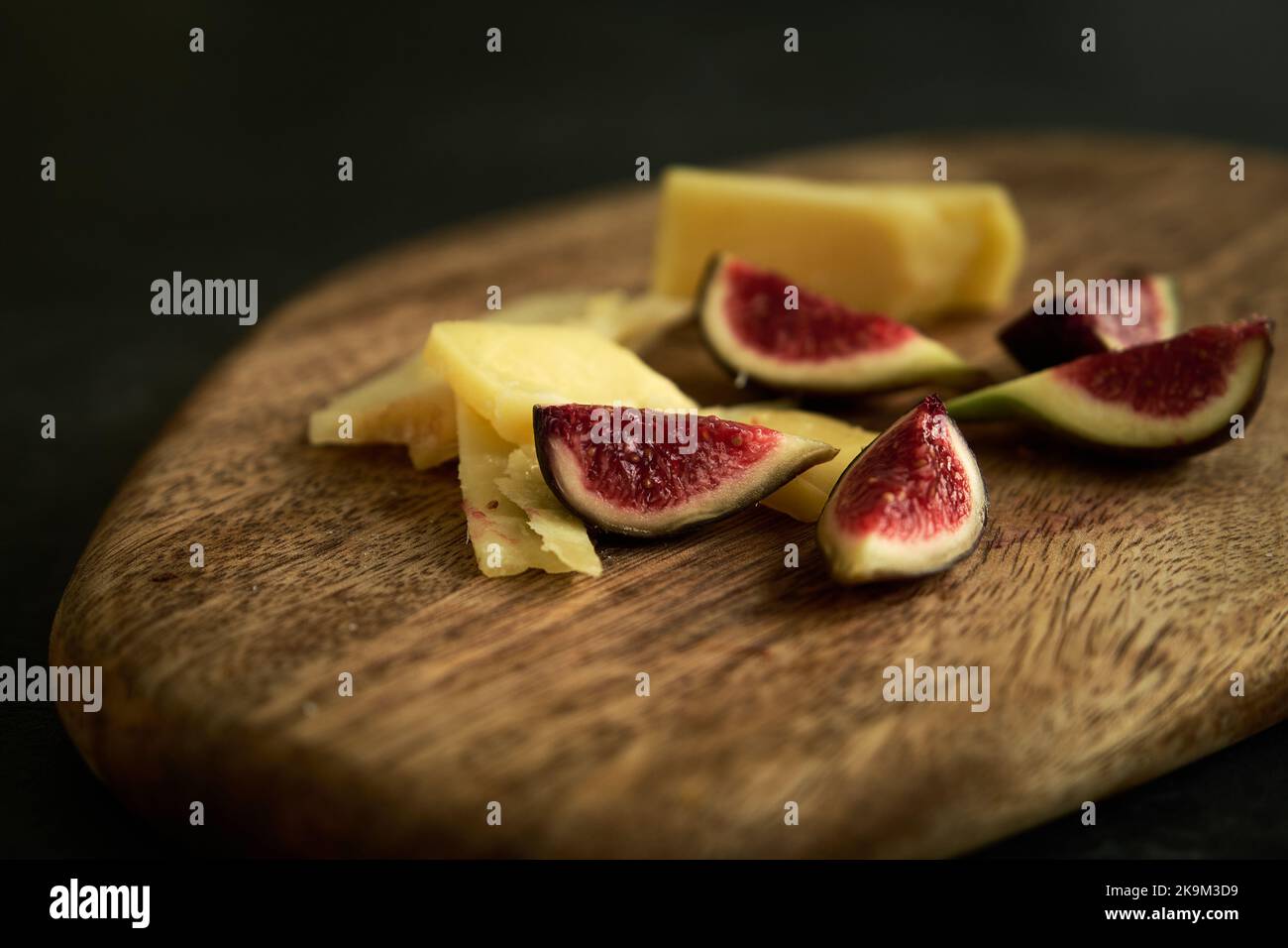 sliced figs on a wooden board Stock Photo