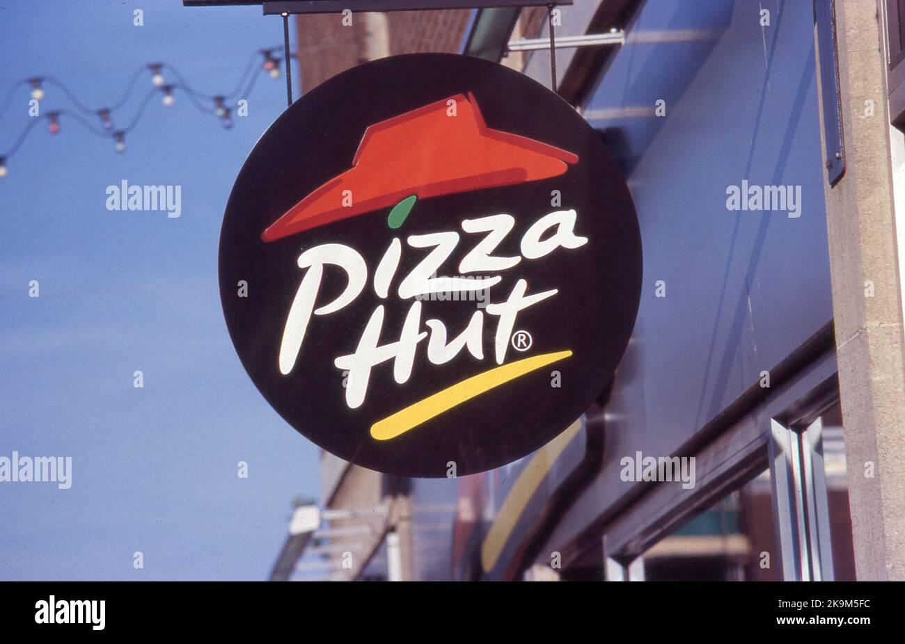 Signage outside a branch of international pizza chain Pizza Hut at