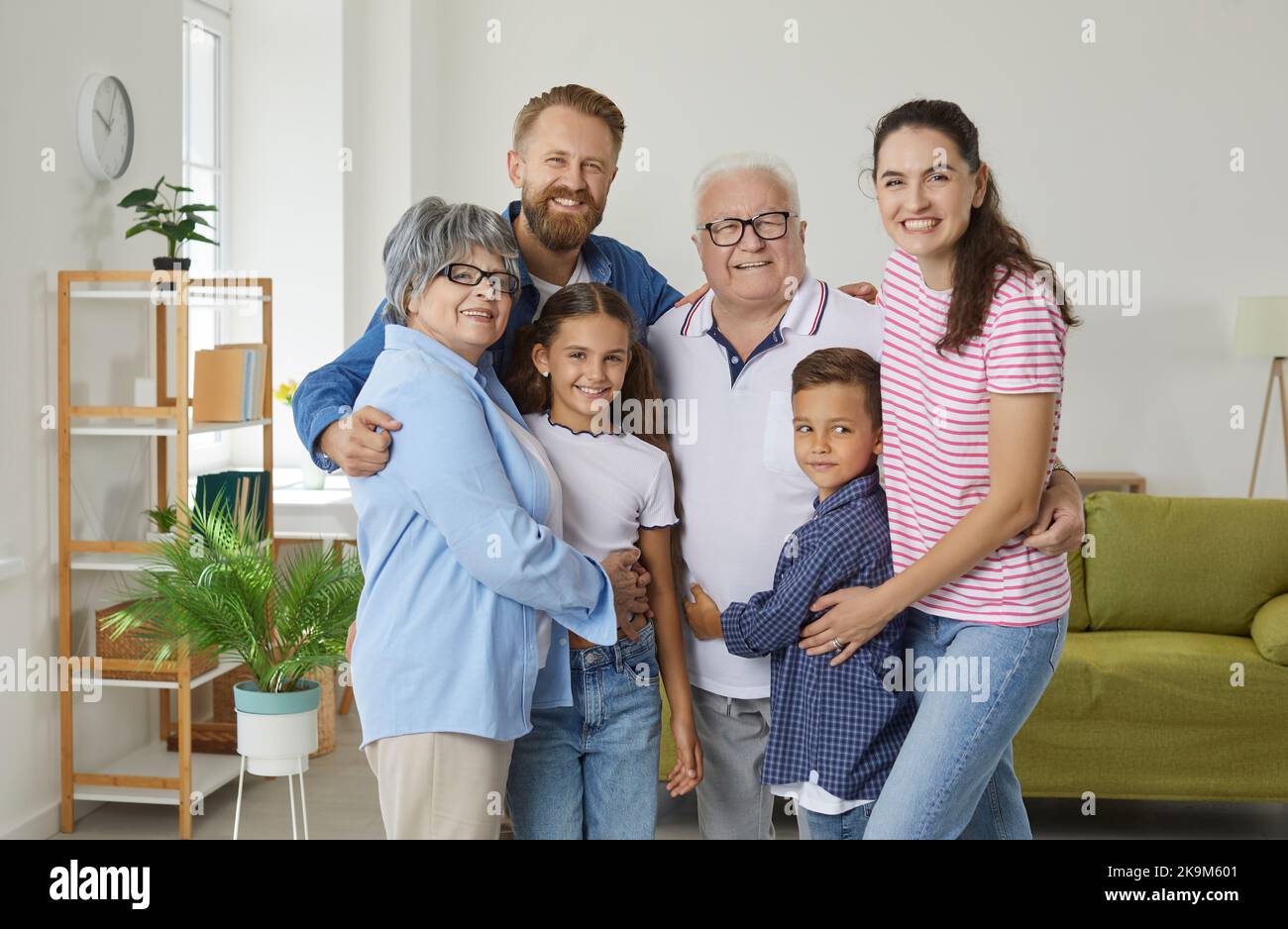 Portrait of happy family with three generations from grandchildren to parents and grandparents. Stock Photo