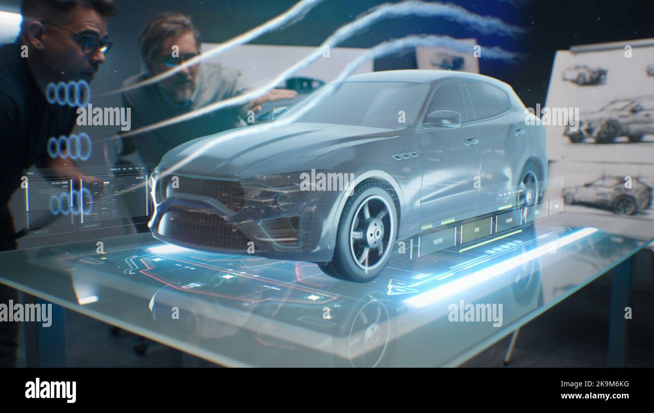 Car design engineers using holographic app in digital tablet. Develop modern innovative high-tech cutting edge eco-friendly electric car with sustainable standards. They test the aerodynamic qualities Stock Photo