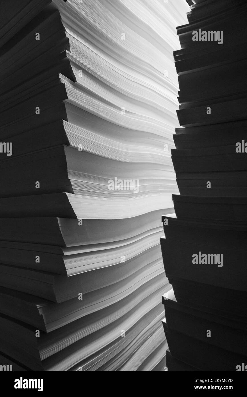 illuminated-stacks-of-white-paper-stock-photo-alamy