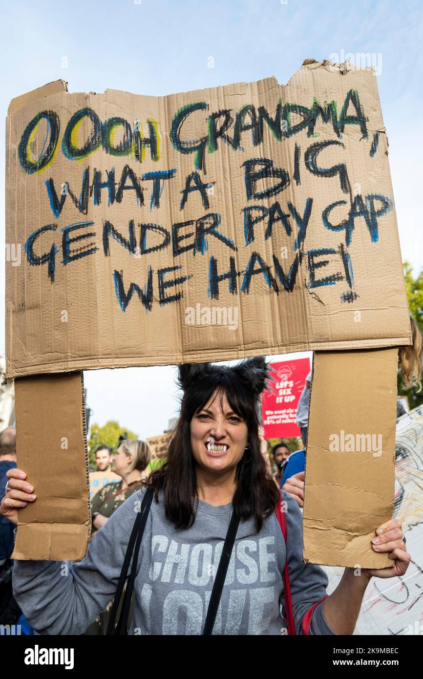 London, UK. 29 October 2022. A parent in Whitehall takes part in 'March of  the Mummies' demanding Government reform on childcare, parental leave and  flexible working. Protesters are marching from Trafalgar Square