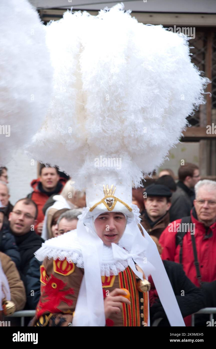 Gilles in traditional dress, Carnival procession, Binche, Belgium - The Gilles with their ostrich feather head-dresses walk through Binche on Shrove T Stock Photo