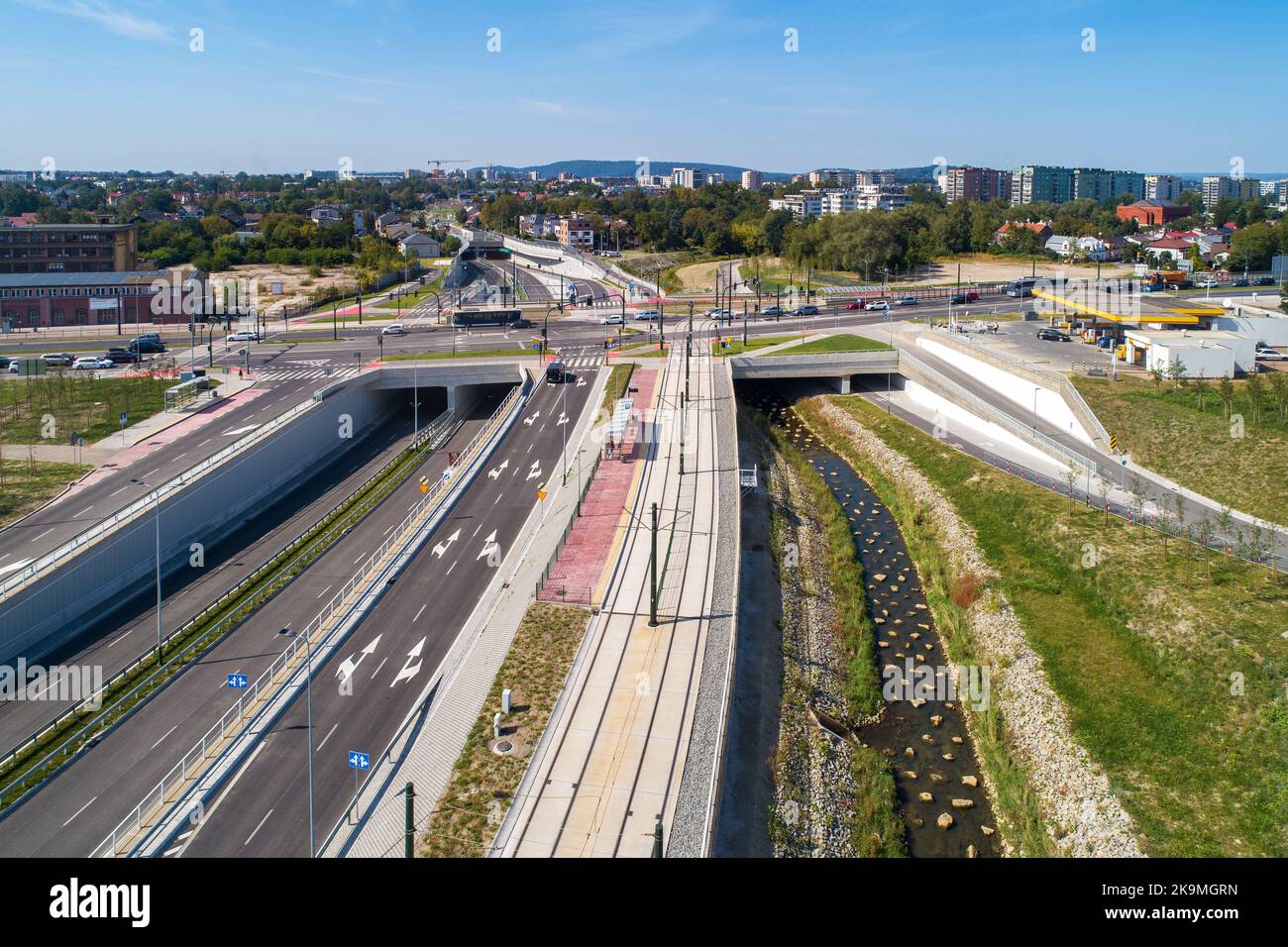 New city highway Trasa Lagiewnicka in Krakow, Poland, with tunnels, tramway, bridge over Wilga river, tunnels for cycle path and pedestrians. Multilev Stock Photo