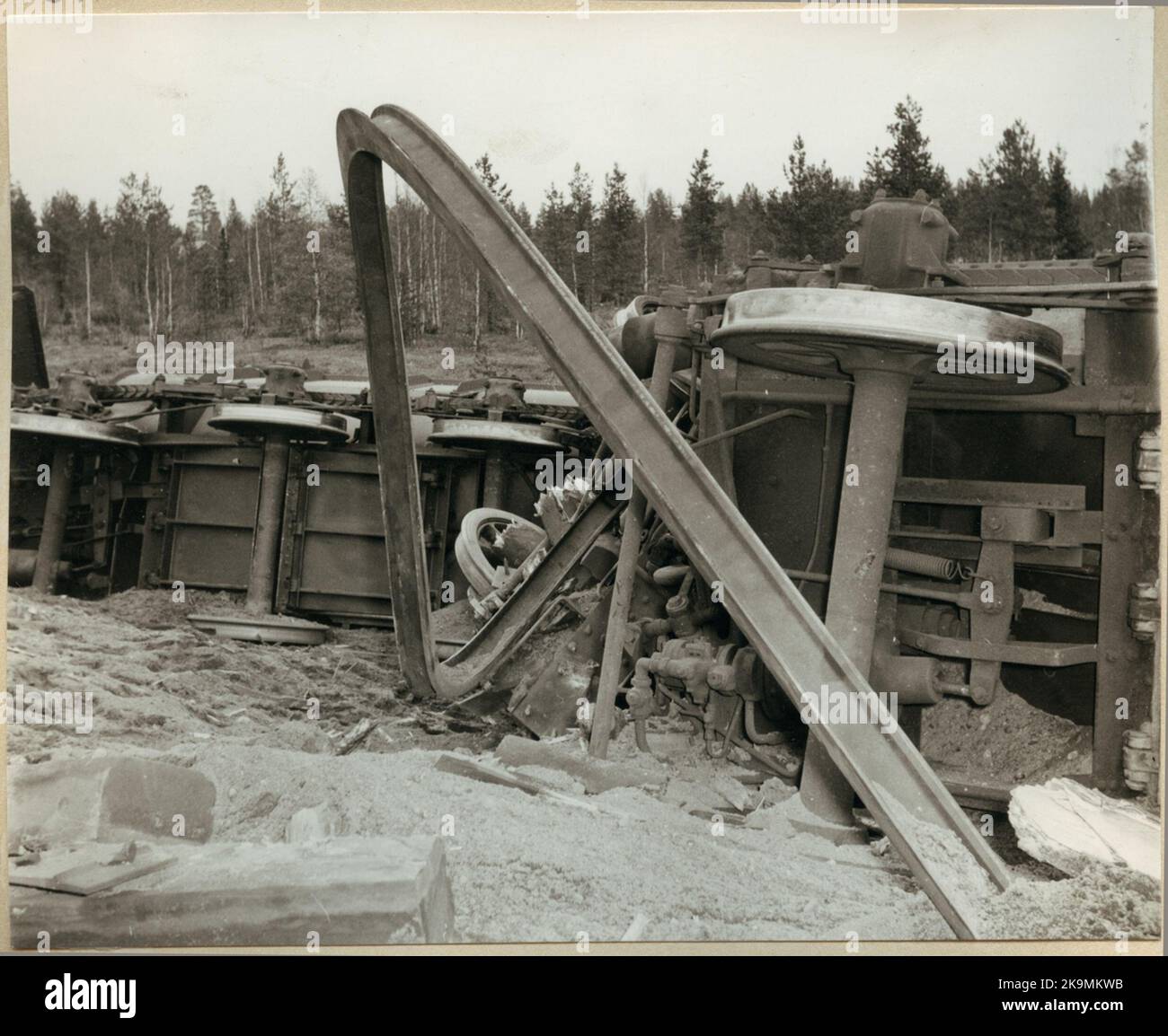 Wheel axles belonging to deleted ore trolleys at the accident in Nattavaara in 1953. In the foreground, the railway rails have been curved. Stock Photo