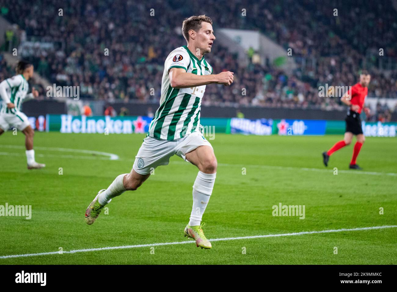 BUDAPEST, HUNGARY - JULY 13: Aleksa Amanovic of FC Tobol challenges  Kristoffer Zachariassen of Ferencvarosi TC during the UEFA Champions League  2022/23 First Qualifying Round Second Leg match between Ferencvarosi TC and