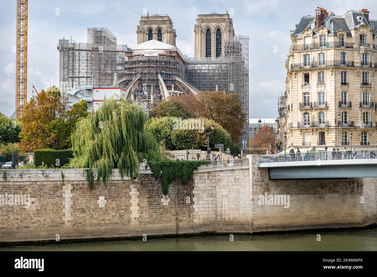 Looking West on the River Seine with scaffolding shrouded Notre Dame in