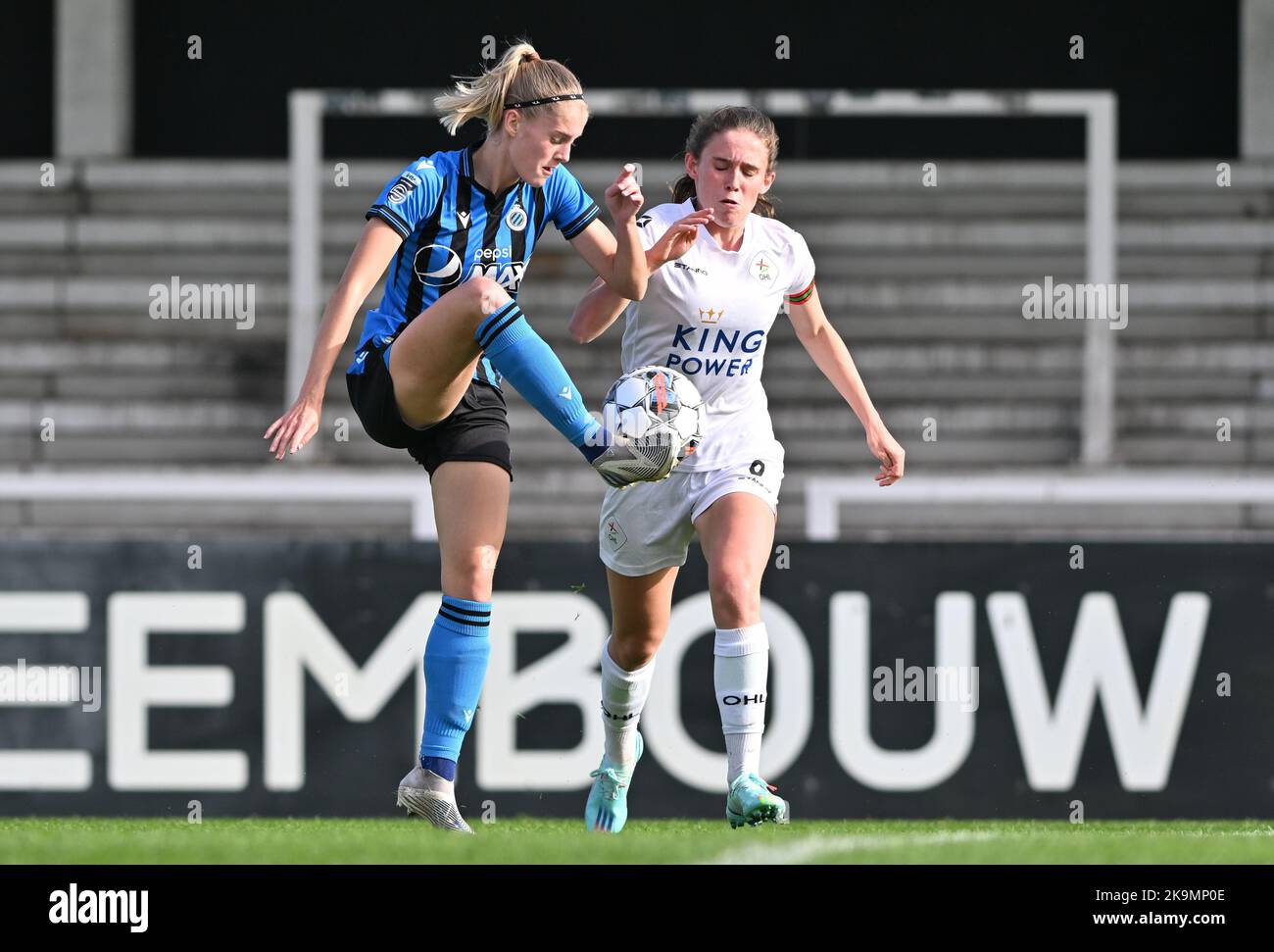 Marith Decabooter (12) of Brugge pictured fighting for the ball with