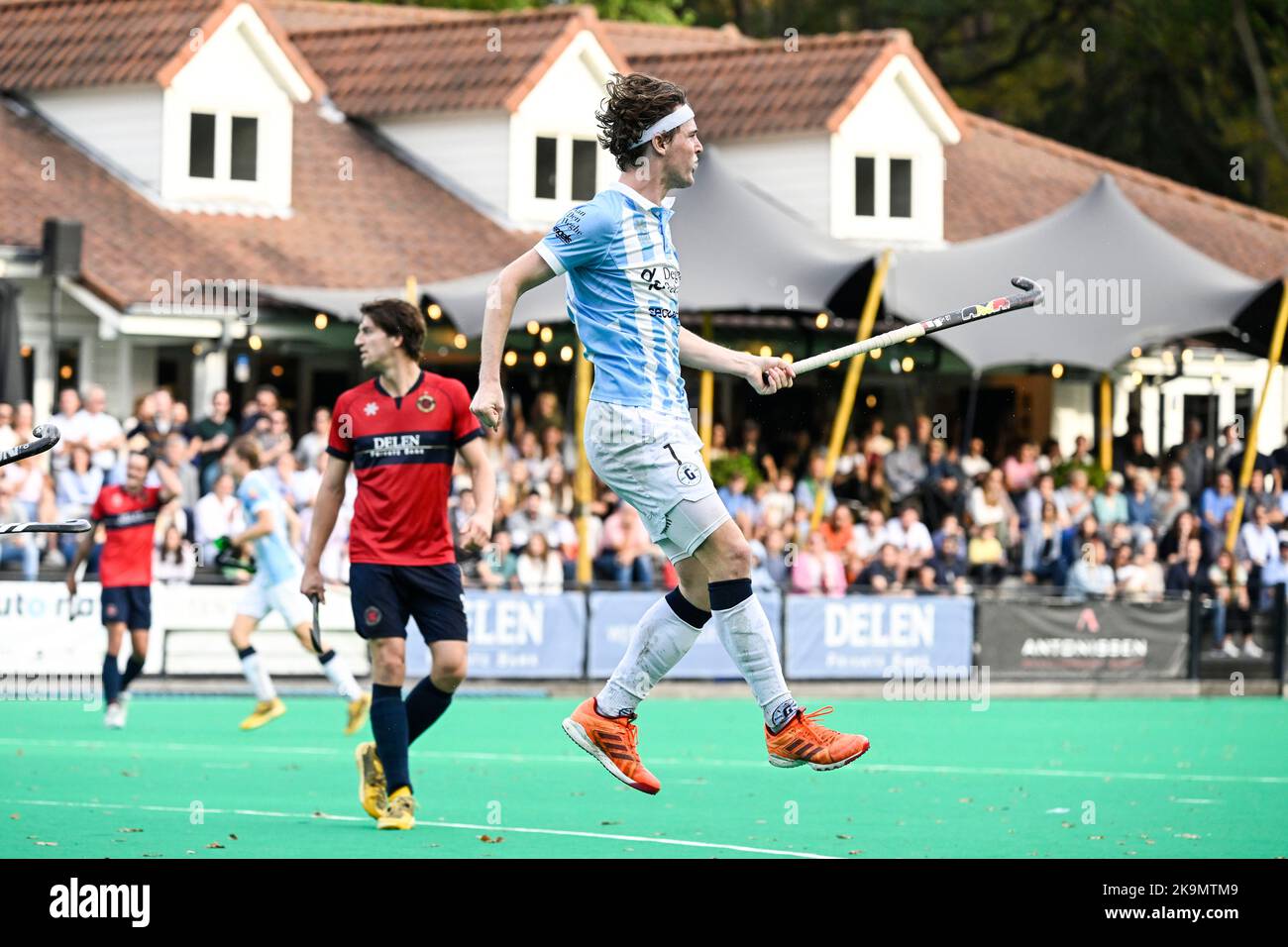 Gantoise's Guillaume Hellin celebrates after scoring during a hockey